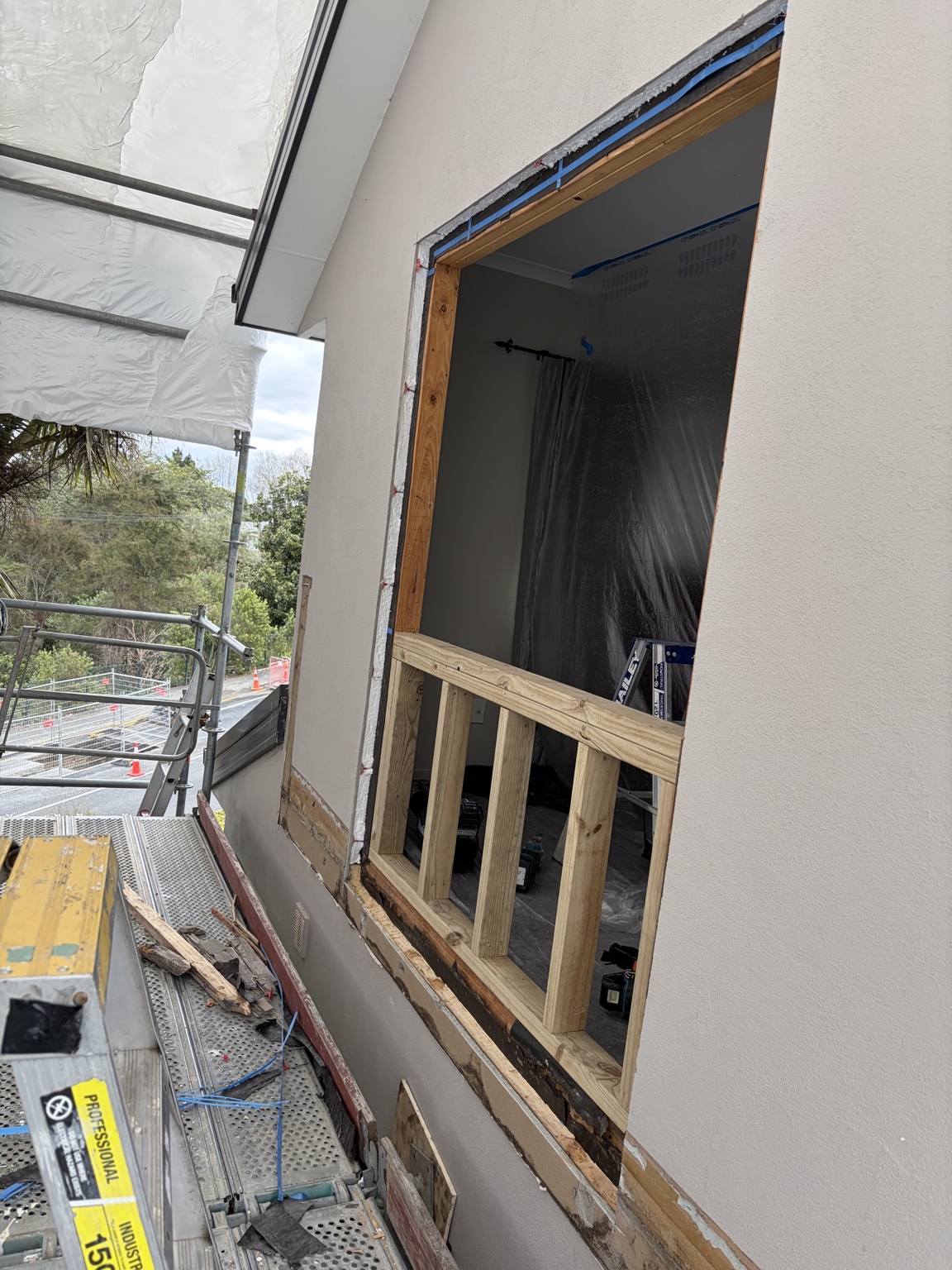 Timber framing in the modified wall opening before the new window