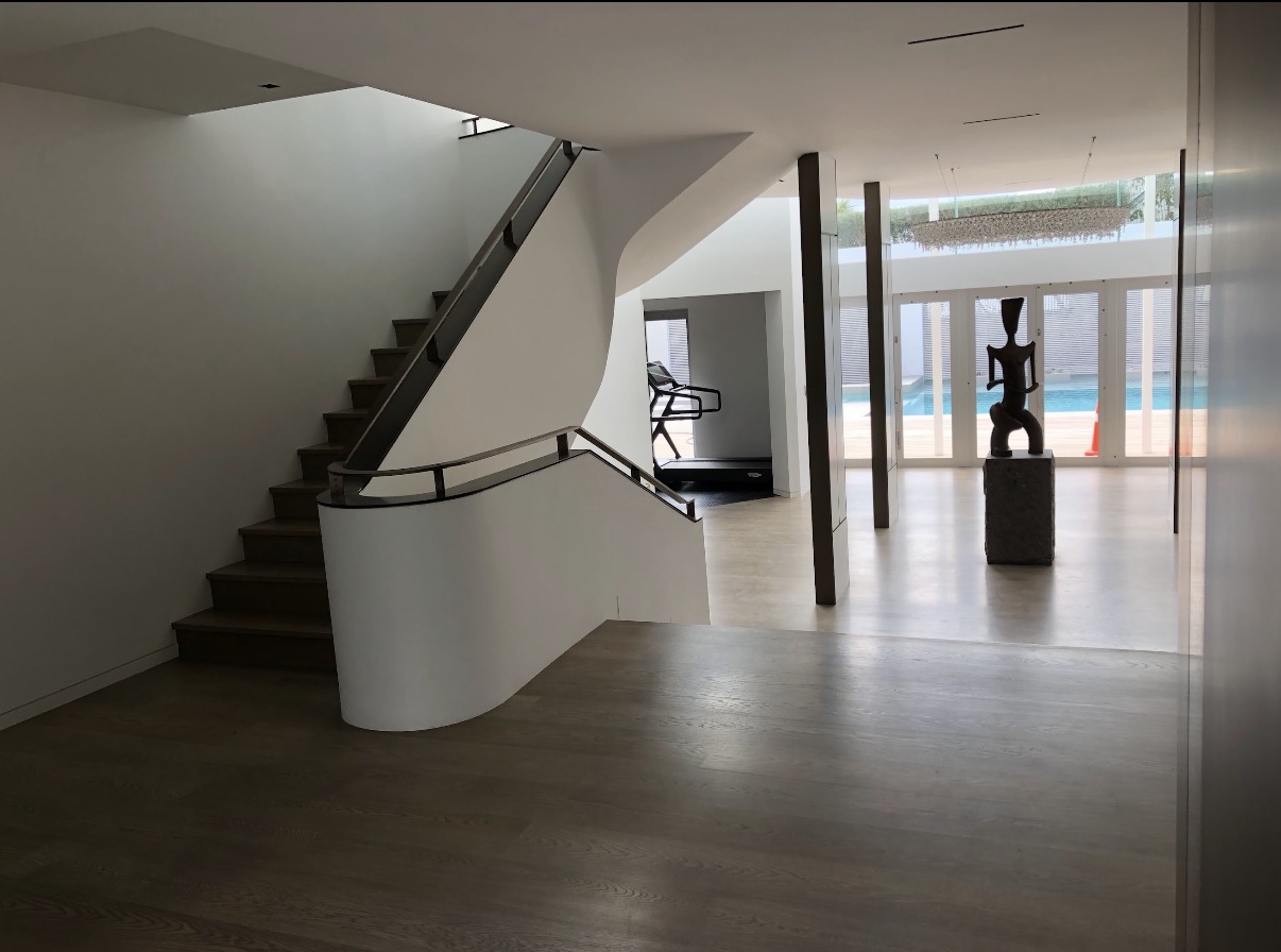 Modernised Herne Bay interior with curved staircase, open spaces and natural light