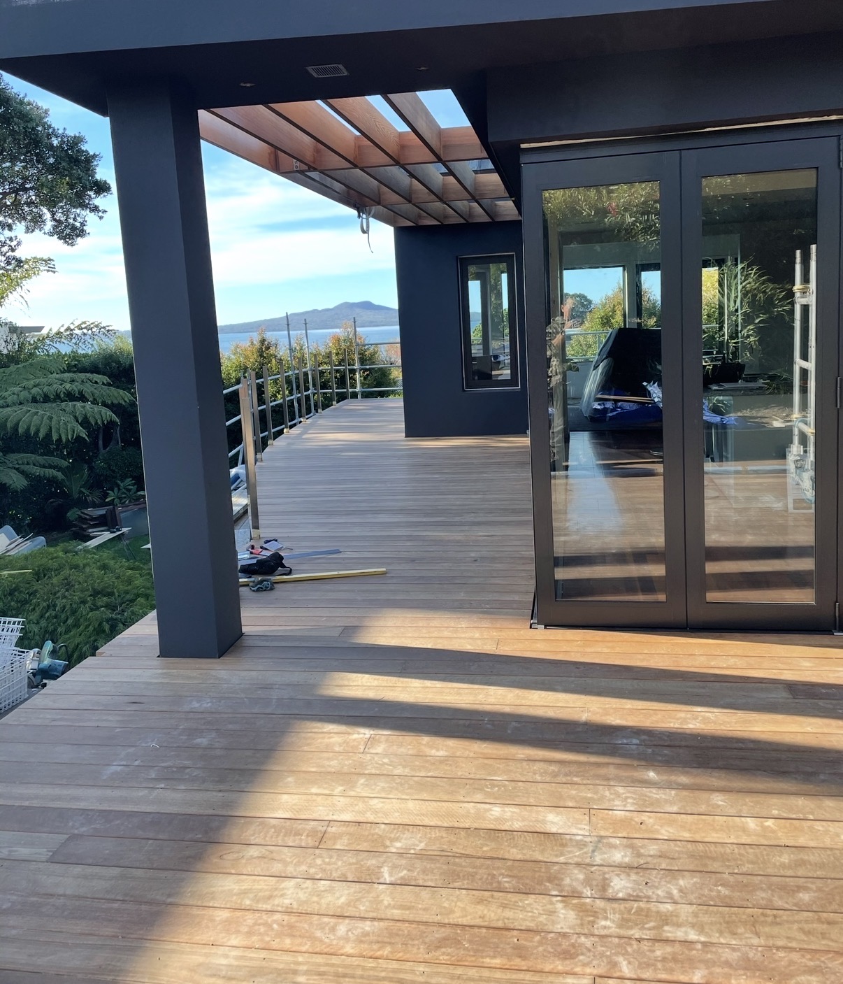 New decking, cedar pergola and joinery overlooking Rangitoto.