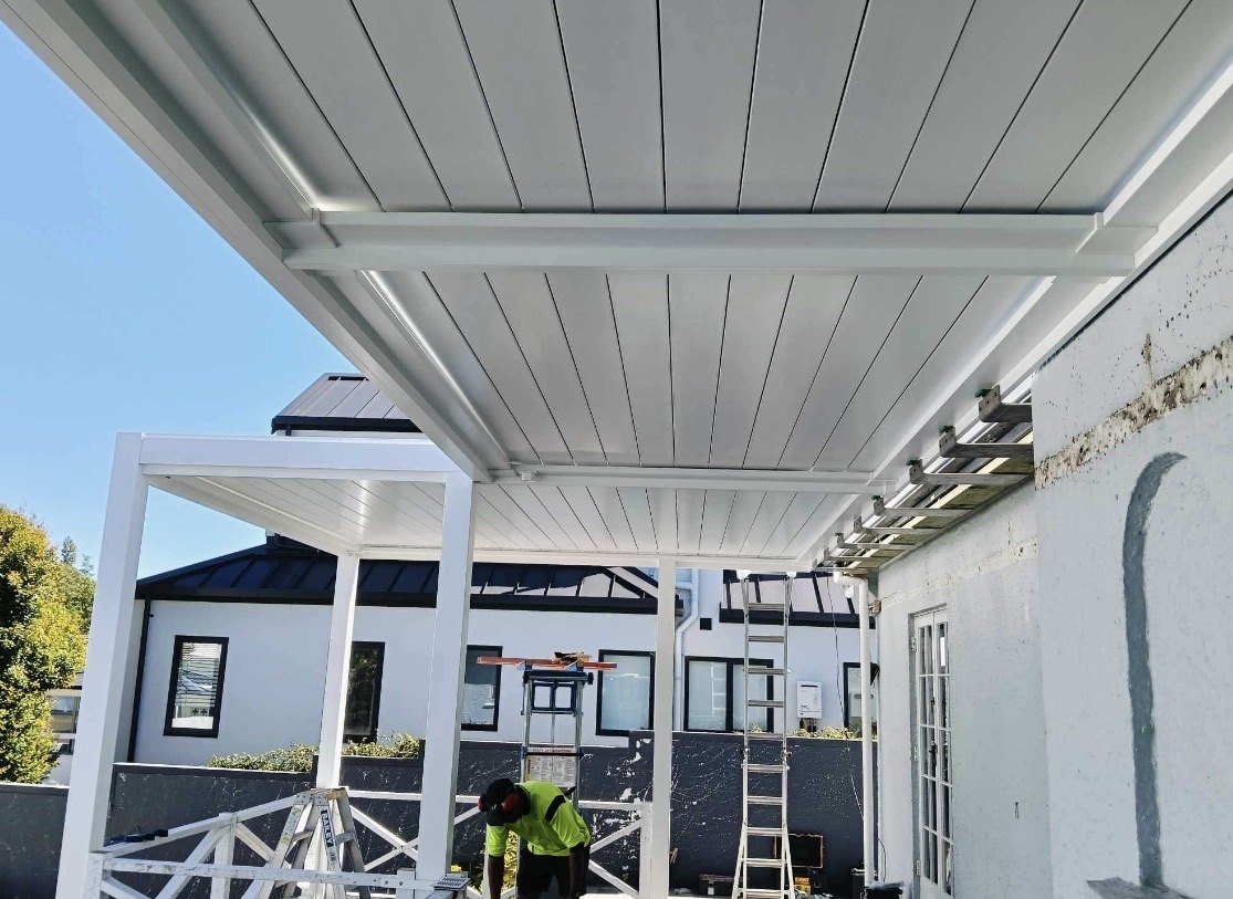 Triple-bay motorised louvred pergola installation in progress on River Road, Hamilton