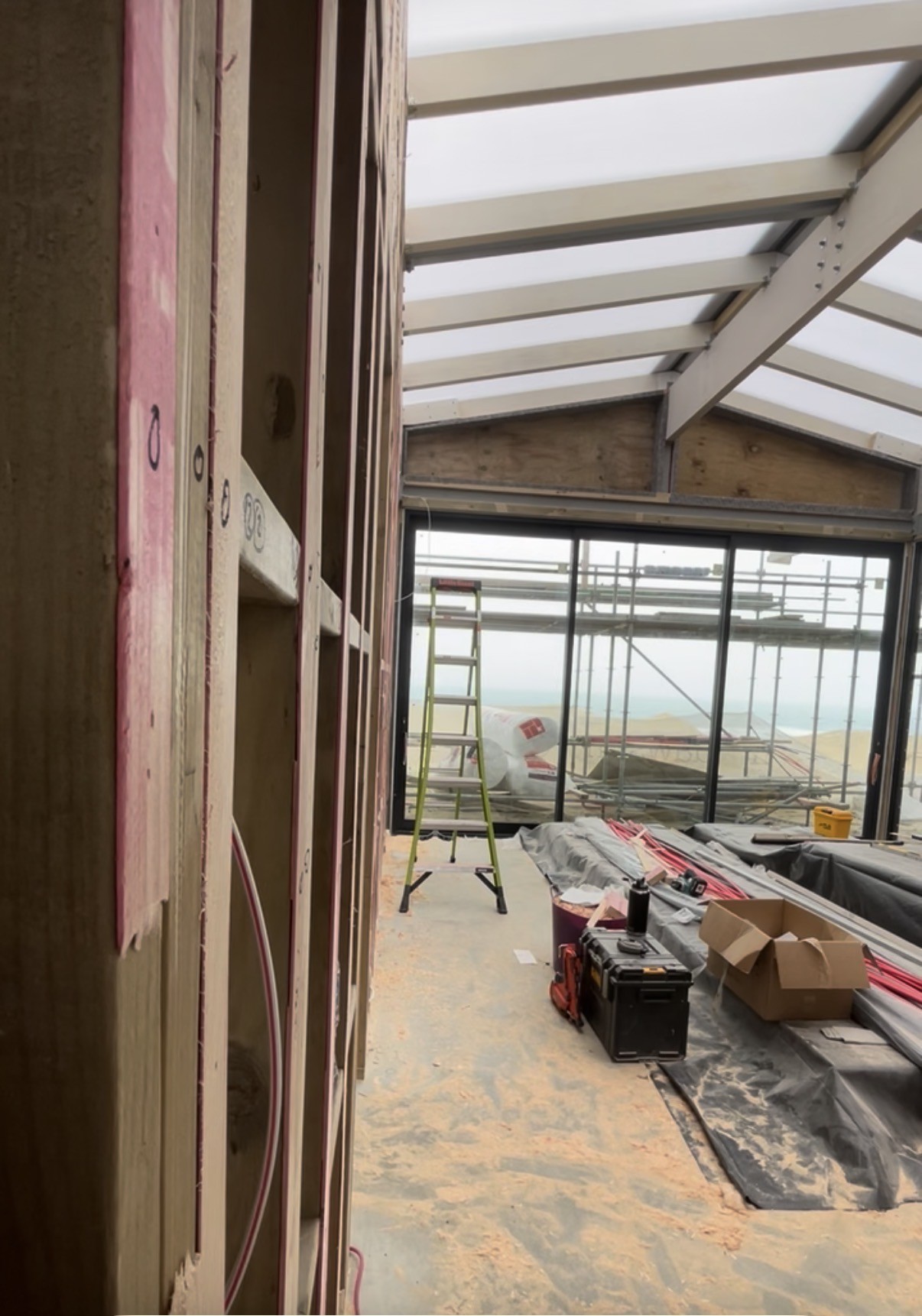 Interior construction with views across the coast.